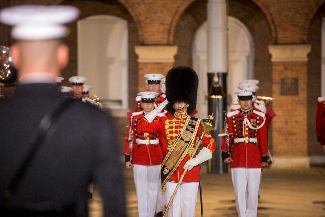 Gunnery Sgt. Stacie Crowther, assistant drum major, “The President’s Own” U.S. Marine Band, renders a salute during a Friday Evening Parade at Marine Barracks Washington D.C., May 11, 2018. The guest of honor for the parade was Deputy Secretary of Defense Patrick M. Shanahan and was hosted by the Assistant Commandant of the Marine Corps, Gen. Glenn M. Walters. (Official Marine Corps photo by Cpl. Robert Knapp/Released)