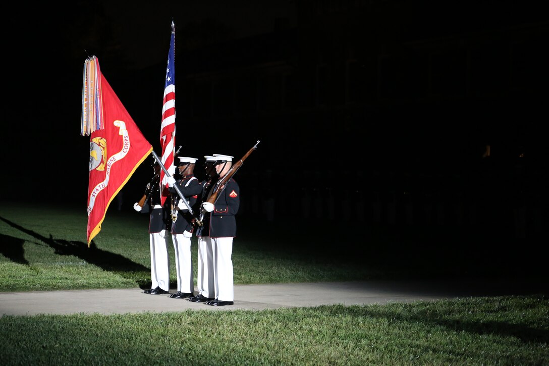 The U.S. Marine Corps Color Guard dips the Marine Corps Battle Colors during the playing of the National Anthem at a Friday Evening Parade at Marine Barracks Washington D.C., May 11, 2018. The guest of honor for the parade was the Deputy Secretary of Defense Patrick M. Shanahan and was hosted by the Assistant Commandant of the Marine Corps Gen. Glenn M. Walters.