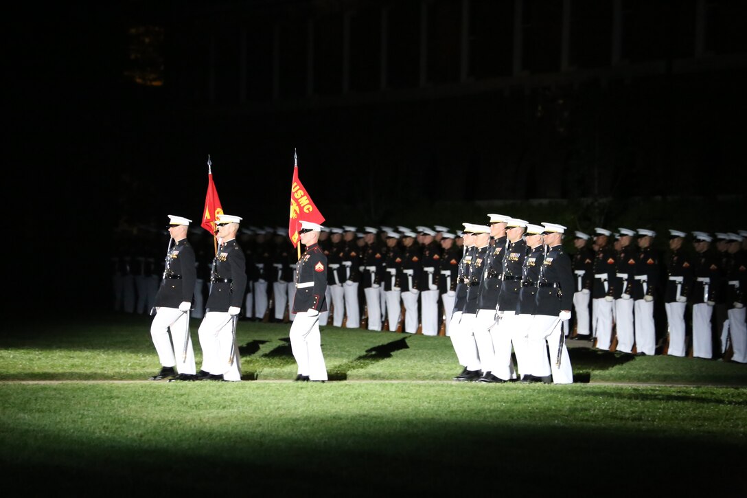 Marine Barracks Washington D.C. officers and company guideon bearers march down Center Walk during a Friday Evening Parade, May 11, 2018. The guest of honor for the parade was the Deputy Secretary of Defense Patrick M. Shanahan and was hosted by the Assistant Commandant of the Marine Corps Gen. Glenn M. Walters.