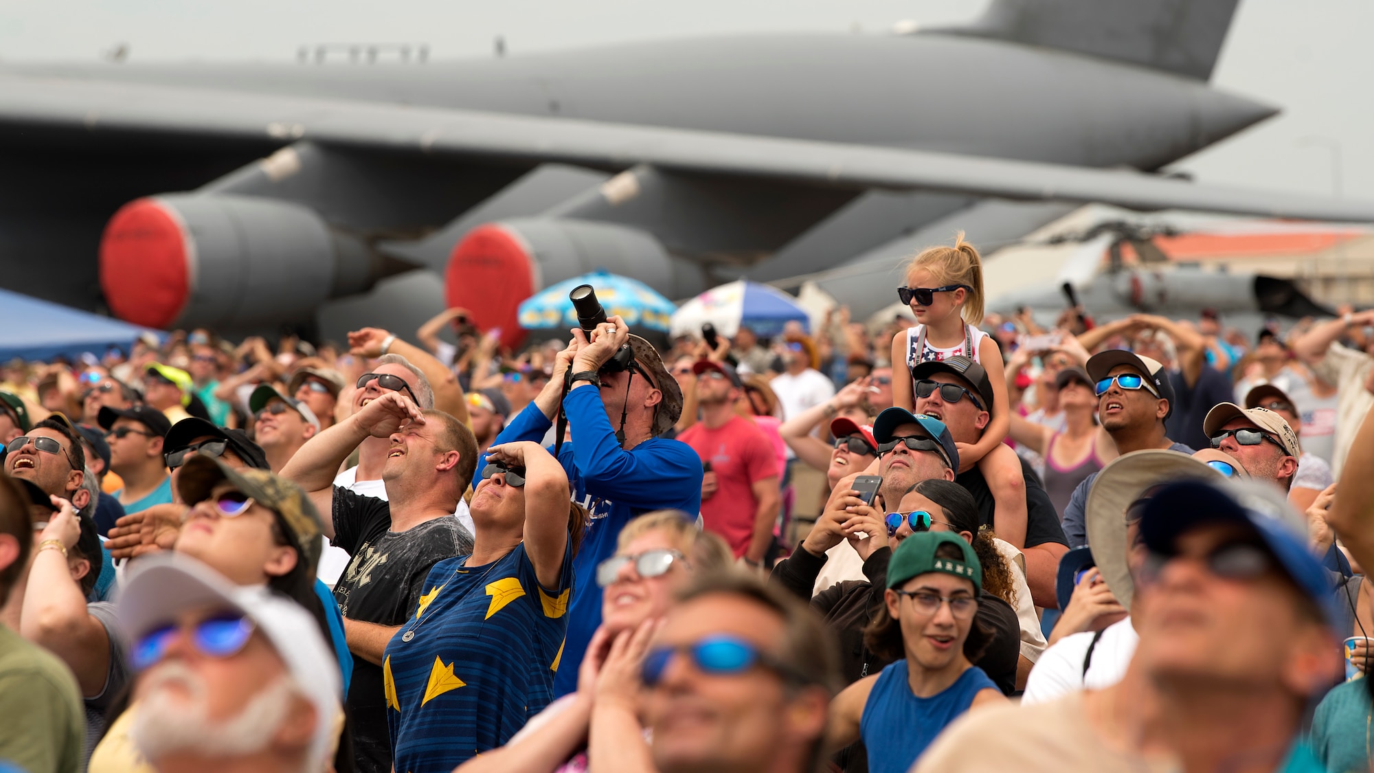 Spectators watch an aerial demonstration during Tampa Bay AirFest 2018 hosted at MacDill Air Force Base, Fla., May 12-13, 2018. MacDill opened its doors to more than 150,000 community members during Mother’s Day weekend.