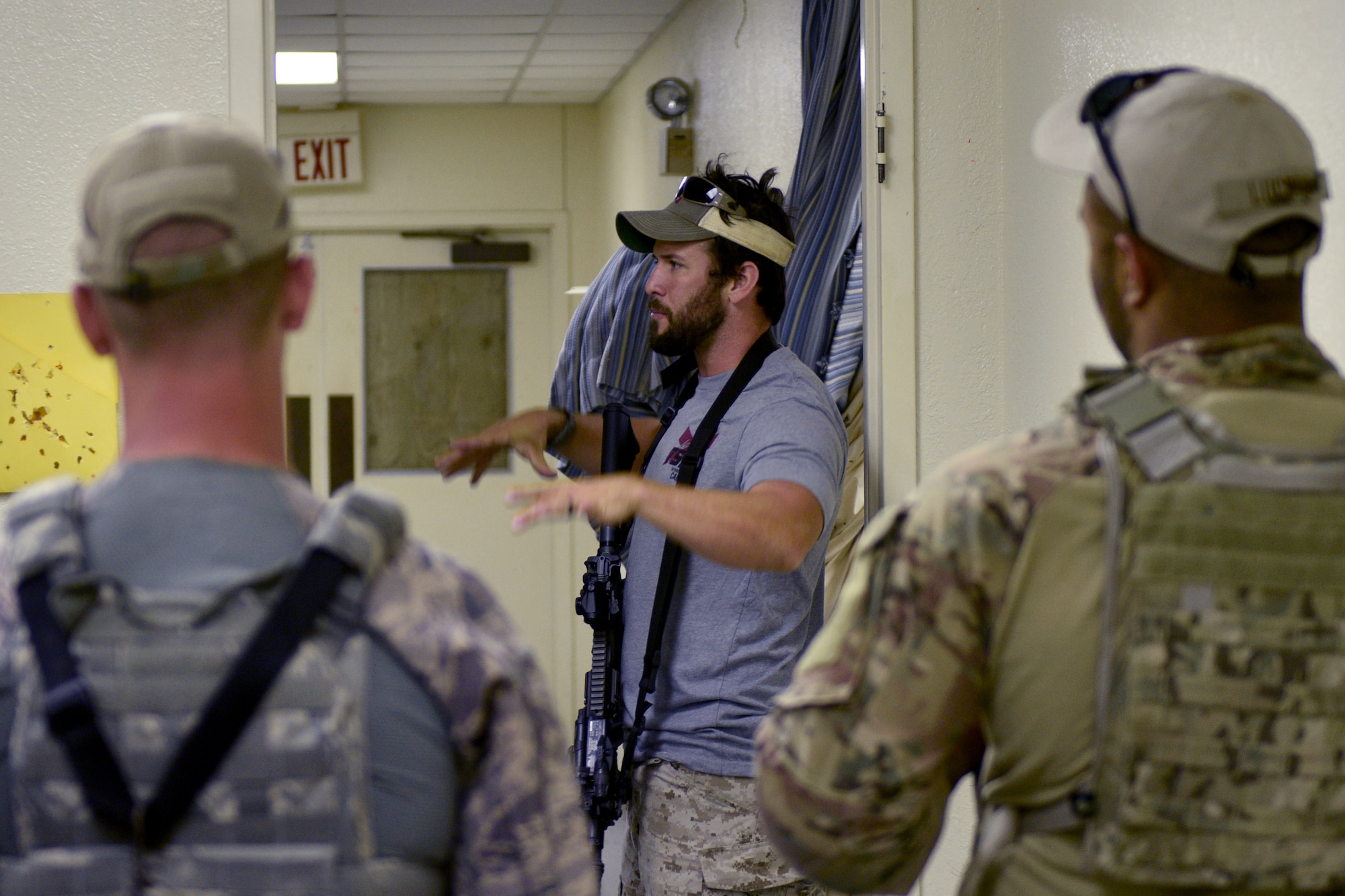 The Shooting Institute chief executive officer, Jared Hudson, demonstrates close quarters combat maneuvers during the Special Weapons and Tactics and Close Quarters Combat training at the Eldorado Air Force Station in Eldorado, Texas, May 10, 2018. The Shooting Institute, a company made up of former Navy SEALS, special operations and law enforcement individuals that travels around providing expert level firearms and tactical training provided the training. (U.S. Air Force photo by Senior Airman Randall Moose/Released)