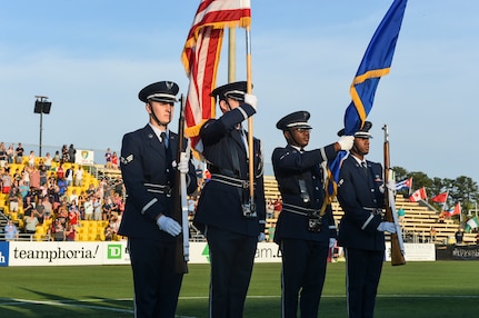 Members of the Joint Base Charleston Honor Guard present the colors during the national anthem for the Charleston Battery Military Appreciation Night at MUSC Health Stadium on Daniel Island in Charleston, S.C., May 12, 2018. The National Anthem was performed by the Iron Horse Choir from Philip Simmons Elementary School in Wando, S.C.