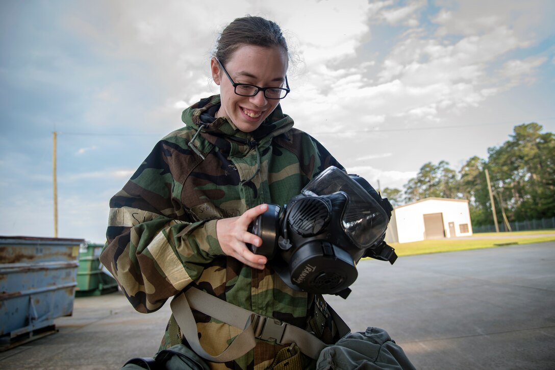 Staff Sgt. Patricia Lee, 23d Maintenance Squadron munitions technician, inspects her gas mask prior to a bomb building course, May 10, 2018, at Moody Air Force Base, Ga. To ensure readiness to complete their mission efficiently, Airmen practiced constructing a Joint Direct Attack Munition while wearing Mission Oriented Protective Posture gear to further simulate what their mission could entail. (U.S. Air Force photo by Airman 1st Class Eugene Oliver)