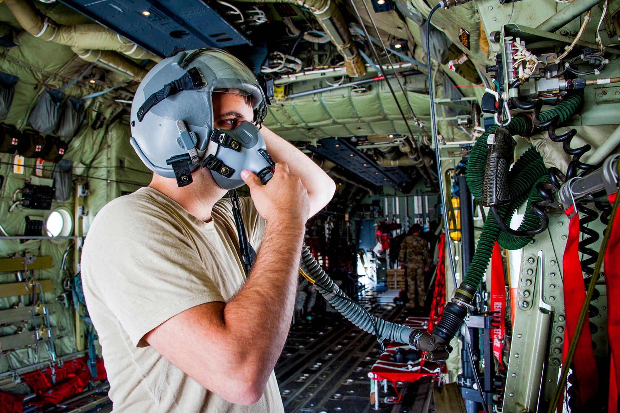 U.S. Air Force Reserve Senior Airman Dustin Lenard, 327th Airlift Squadron loadmaster, performs pre-flight checks in Amman, Jordan on April 16, 2018.