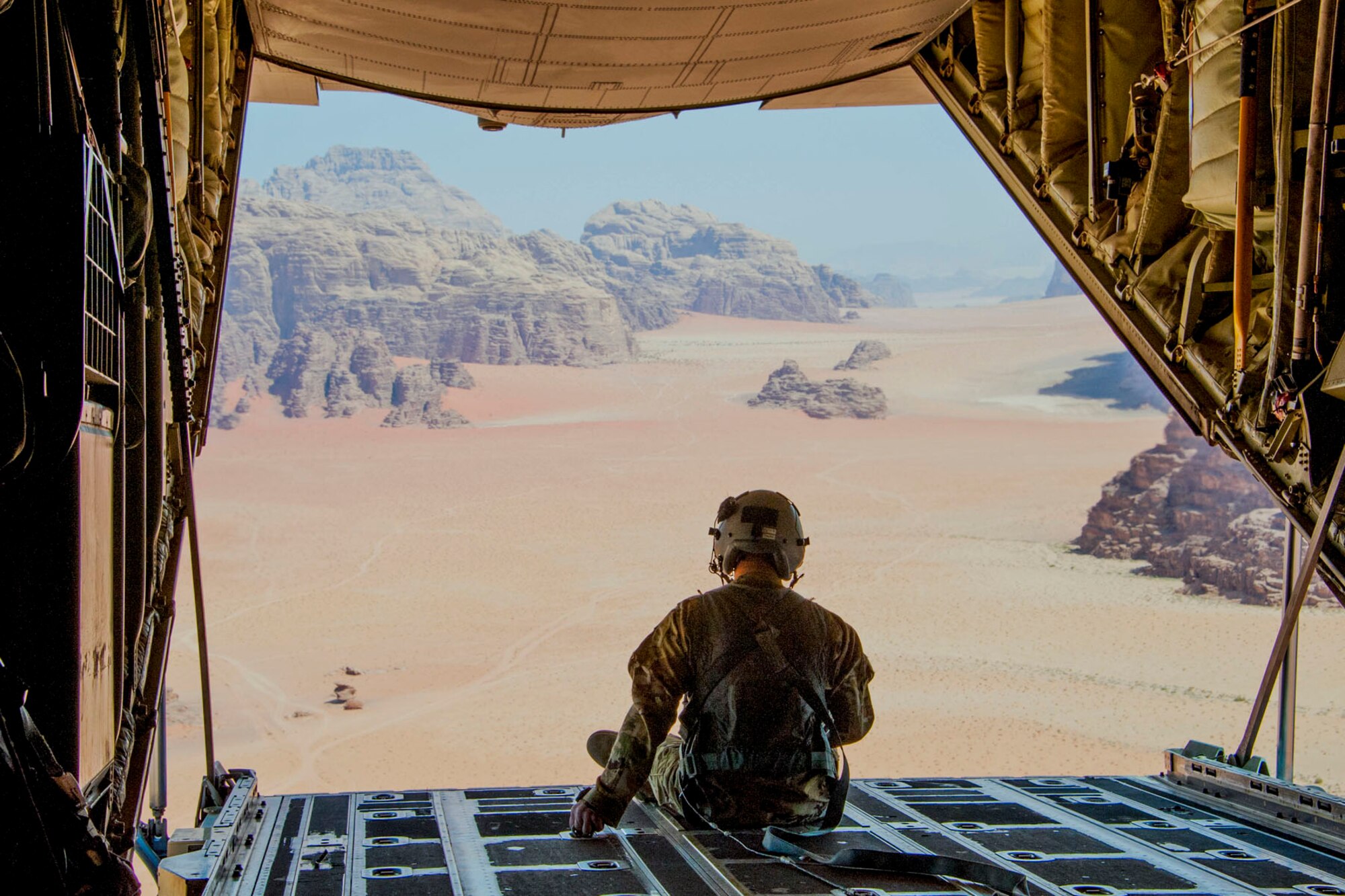 U.S. Air Force Reserve Master Sgt. Scott Klobucher, a loadmaster assigned to the 327th Airlift Squadron, 913th Airlift Group, takes in Wadi Rum in southern Jordan April 16, 2018 while supporting Eager Lion 2018.