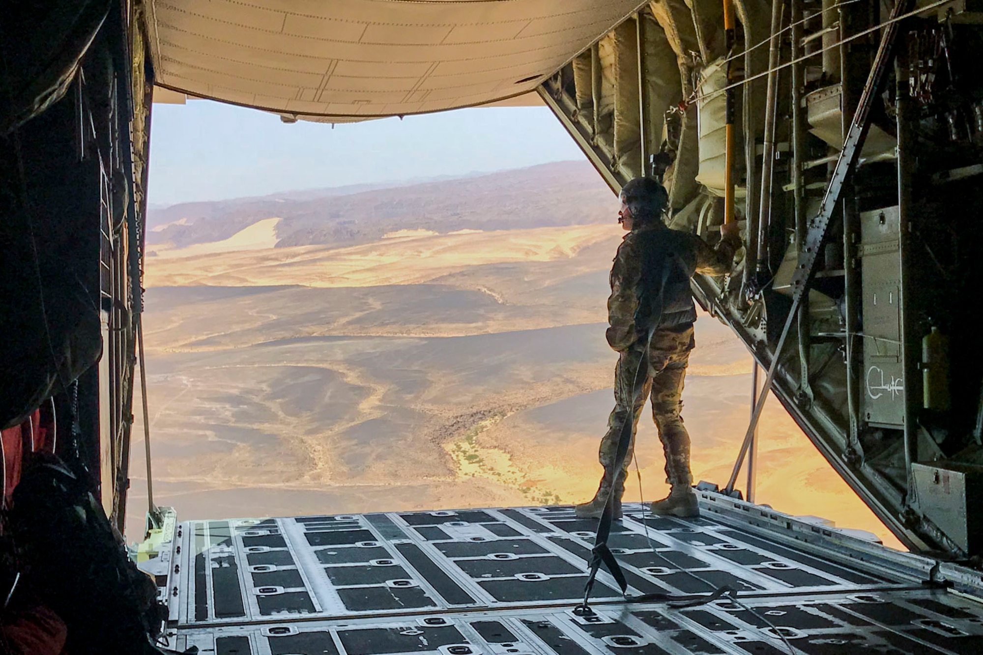 U.S. Air Force Reserve Master Sgt. Scott Klobucher, a loadmaster assigned to the 327th Airlift Squadron, 913th Airlift Group, takes in the landscape of southern Jordan April 17, 2018 while supporting Eager Lion 2018.