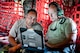 U.S. Air Force Reserve Tech. Sgt. Jimmy Myers, propulsion technician, and Tech. Sgt. Christopher Holmes, aircraft electrician, check technical orders in Amman, Jordan, April 15, 2018.