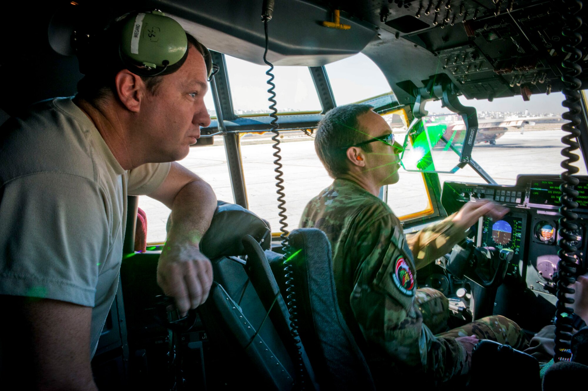 U.S. Air Force Reserve Senior Master Sgt. Edwin Wiegand, 913th Maintenance Squadron avionics systems lead technician,, and Capt. Benjamin Buchanan, pilot, perform pre-flight checks in Amman, Jordan on April 15, 2018.
