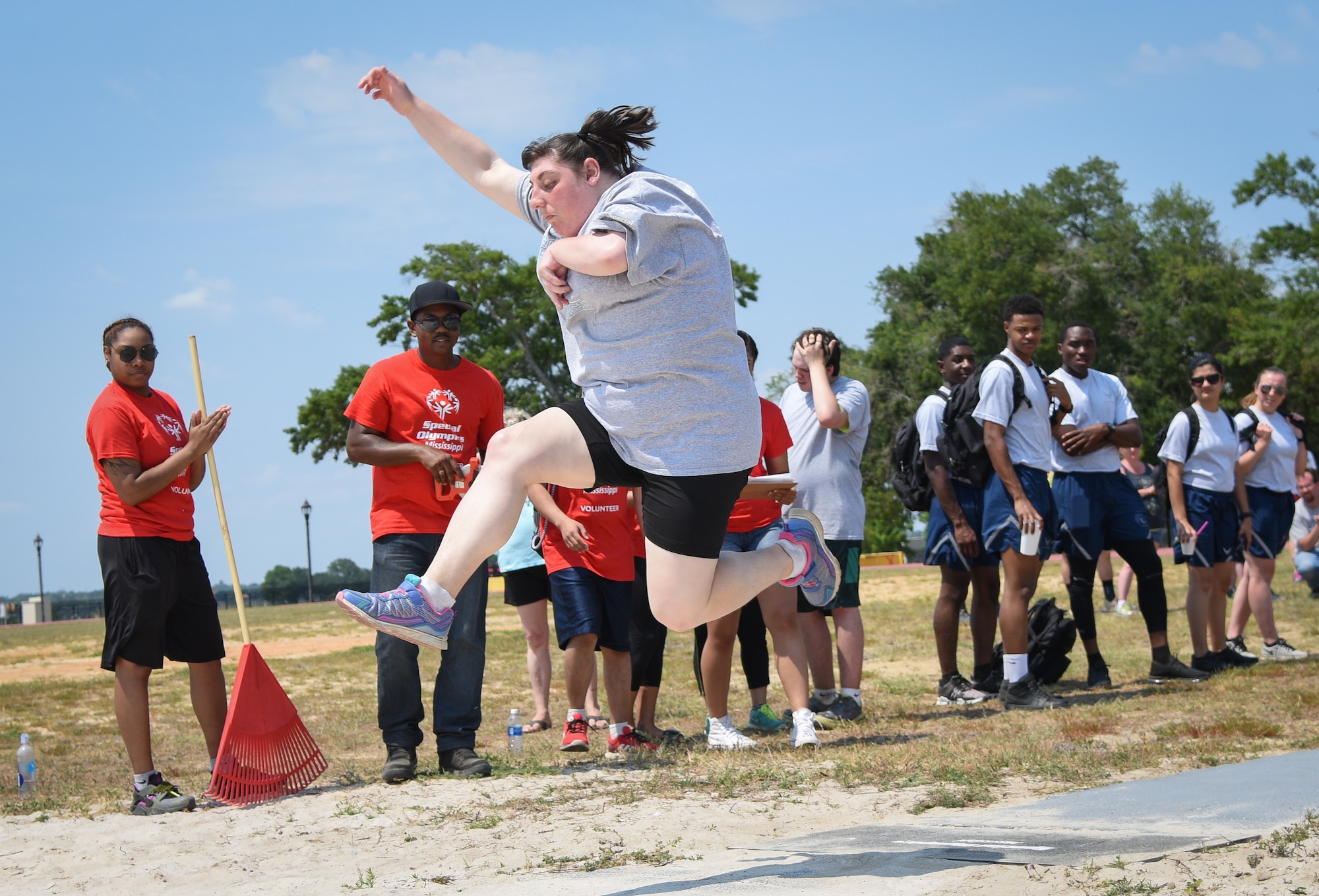 Cassidy Gamblin, Area 16 athlete, competes in the running long jump during the Special Olympics Mississippi 2018 Summer Games at the Triangle Track at Keesler Air Force Base, Mississippi, May 12, 2018. Founded in 1968, Special Olympics hosts sporting events around the world for people of all ages with special needs to include more than 700 athletes from Mississippi. (U.S. Air Force photo by Kemberly Groue)