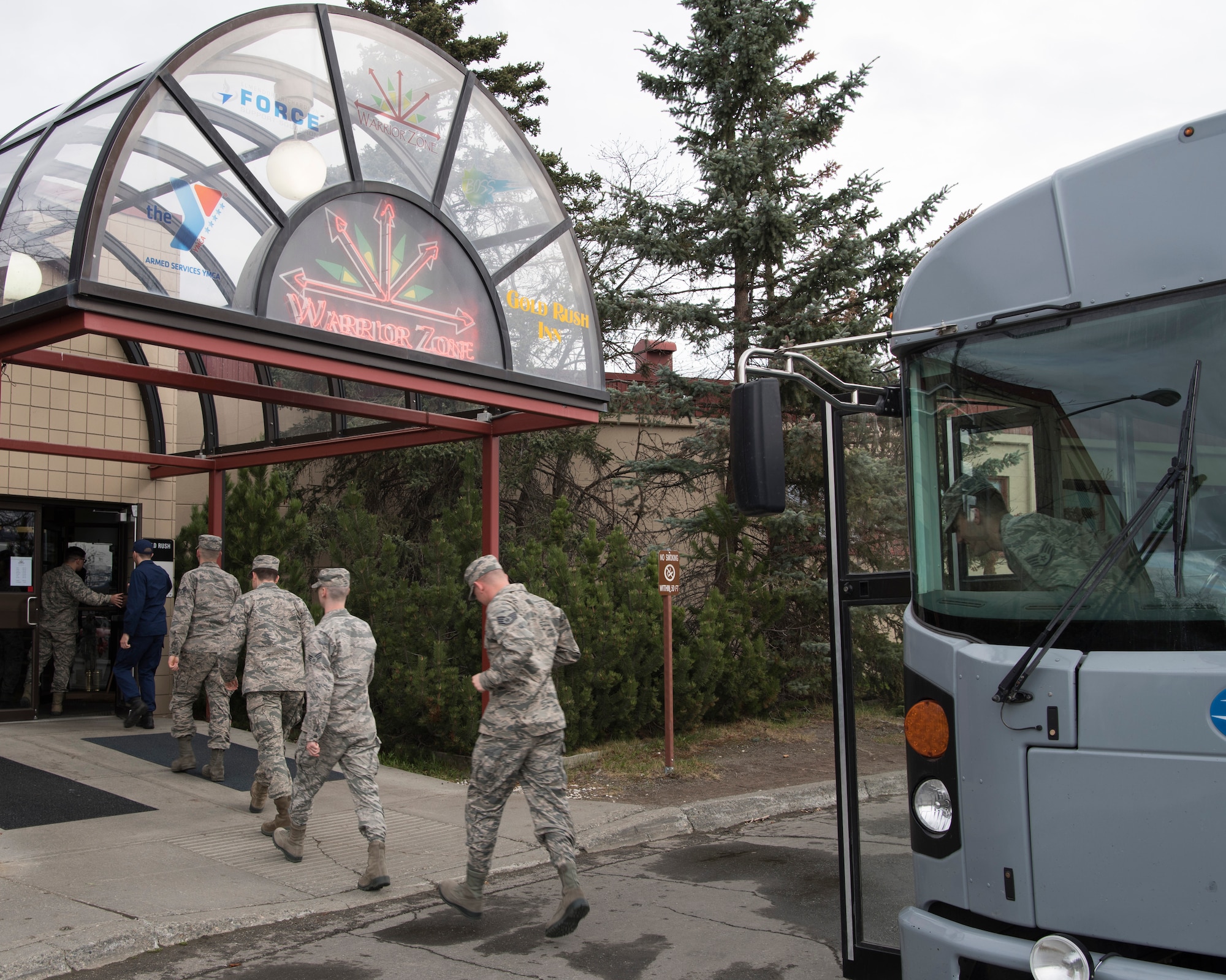 Recent Airman Leadership School graduates walk into the Warrior Zone as part of an Initial Supervisor Resiliency Training bus tour at Joint Base Elmendorf-Richardson, Alaska, May 10, 2018. The tour is a new Pacific Air Forces-wide initiative for all ALS graduates, which offers an opportunity to see and interact with the programs and resources discussed during the course.