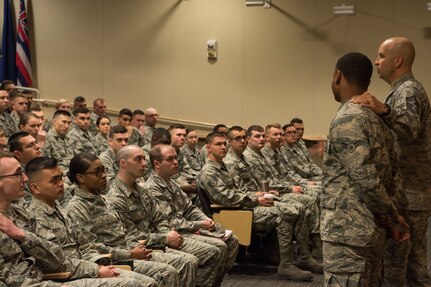 Chief Master Sgt. Charles Orf, 673d Air Base Wing command chief, speaks to Airman Leadership School graduates at Joint Base Elmendorf-Richardson, Alaska, May 10, 2018. The graduates took part in a new Pacific Air Forces-wide initiative for all ALS graduates to reinforce information obtained in Initial Supervisor Resiliency Training. At the forefront of this initiative is a bus tour the day after graduation, which offers an opportunity to see and interact with the programs and resources discussed during the course.