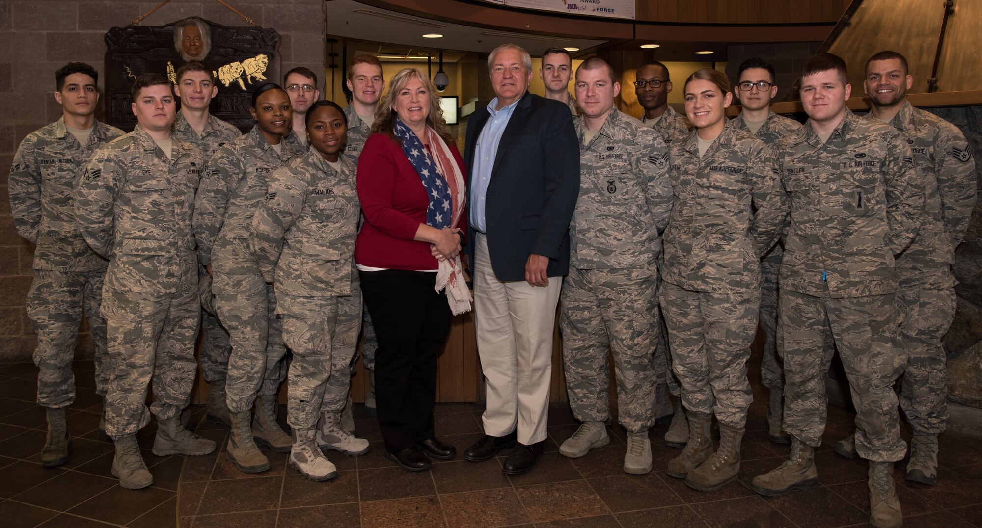 Cory Etchberger and Tracy Megenney, son and granddaughter of Medal of Honor recipient Chief Master Sgt. Richard Etchberger, pose for a photo with Airmen at Joint Base Elmendorf-Richardson, Alaska, May 7, 2018. Cory and Tracy visited JBER to share their loved one’s story with Airmen. Etchberger’s acts of extraordinary heroism during the Vietnam War at Lima Site 85, in Laos, March 11, 1968, saved the lives of three Airmen. He is the only E-9 of any U.S. military branch to receive the Medal of Honor.