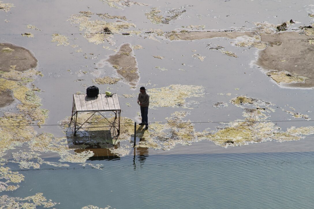 One of the fully restored purposes for the dam is recreation, seen here as a fisherman tries his luck below the dam May 11, 2018.