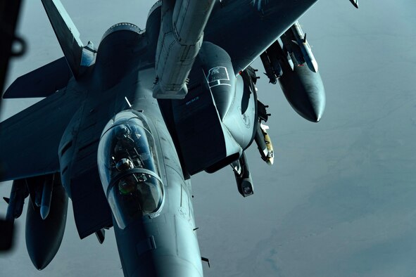 A U.S. Air Force F-15E Strike Eagle assigned to the 48th Fighter Wing, Royal Air Force Lakenheath, prepares to receive fuel from a U.S. Air Force KC-10 Extender from the 380th Air Expeditionary Wing over Southwest Asia, April 21, 2018. (U.S. Air National Guard photo by Tech. Sgt. Nieko Carzis)