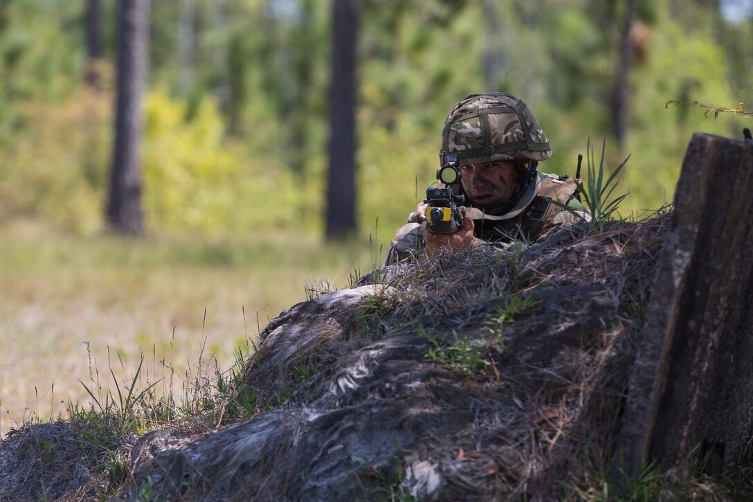 A soldier from the Royal Bermuda Regiment aims down his sight at the Junior Noncommissioned Officer Cadre on Marine Corps Base Camp Lejeune, N.C., May 4, 2018. The JNCO Cadre is a promotions course for promotion from Private Bandsman Drummer to Lance Corporal and is open to all soldiers who have completed one year of service and have the recommendation of their company commander. This training requires additional drill nights and weekends and develops leadership, command skills, military knowledge and strengthens teamwork. (U.S. Marine Corps photo by Cpl. Juan Madrigal)