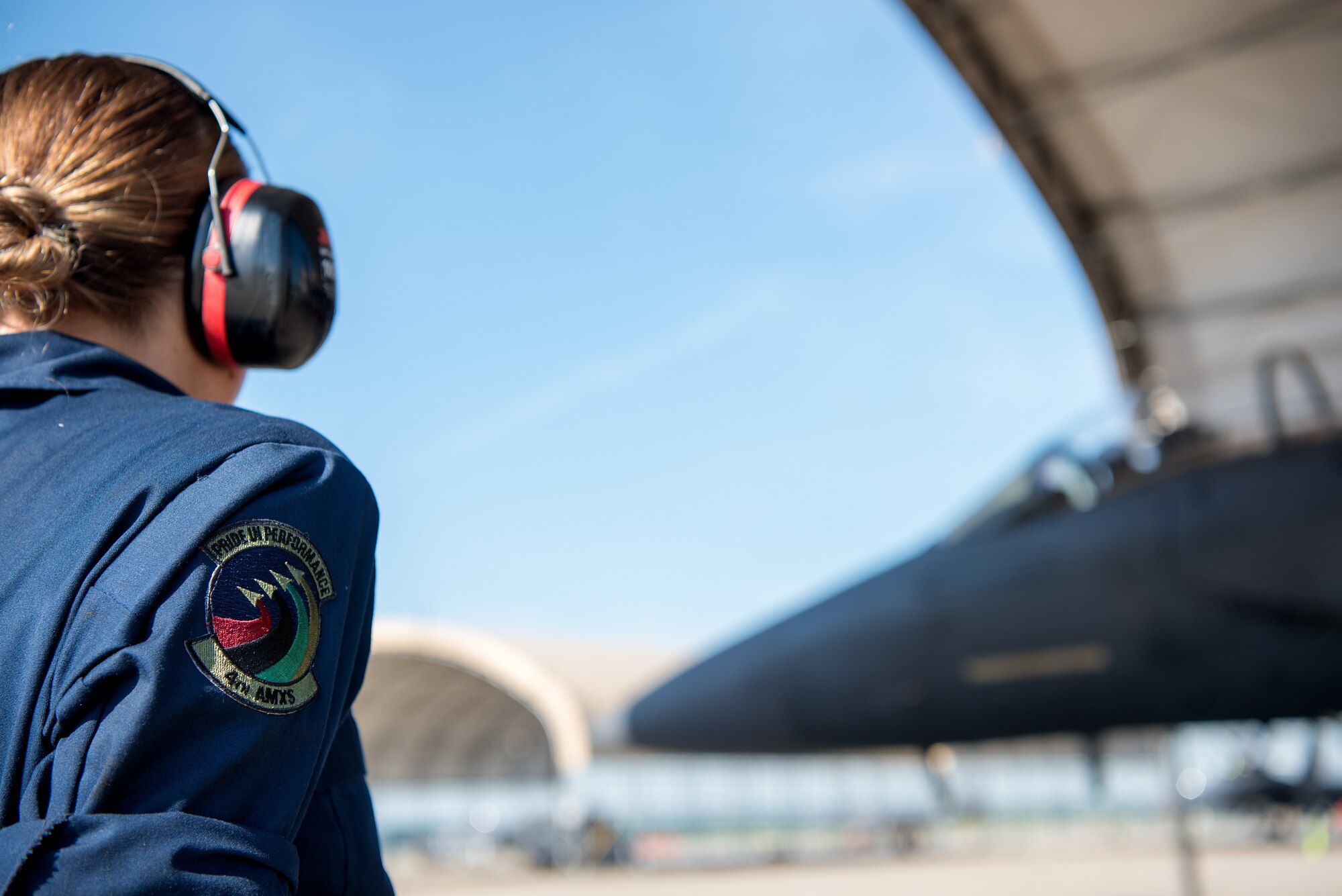 Airman 1st Class Molly Barnett, 4th Aircraft Maintenance Squadron crew chief, looks at an F-15E Strike Eagle as it prepares to taxi to participate in Razor Talon, May 11, 2018, at Seymour Johnson Air Force Base, North Carolina.