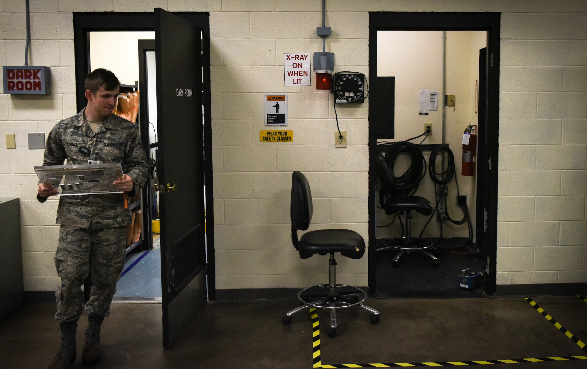 U.S. Air Force Airman 1st Class Tyler Chance, 20th Equipment Maintenance Squadron nondestructive inspection journeyman, carries a Computed Radiography (CR) Phantom at Shaw Air Force Base, S.C., April 25, 2018.