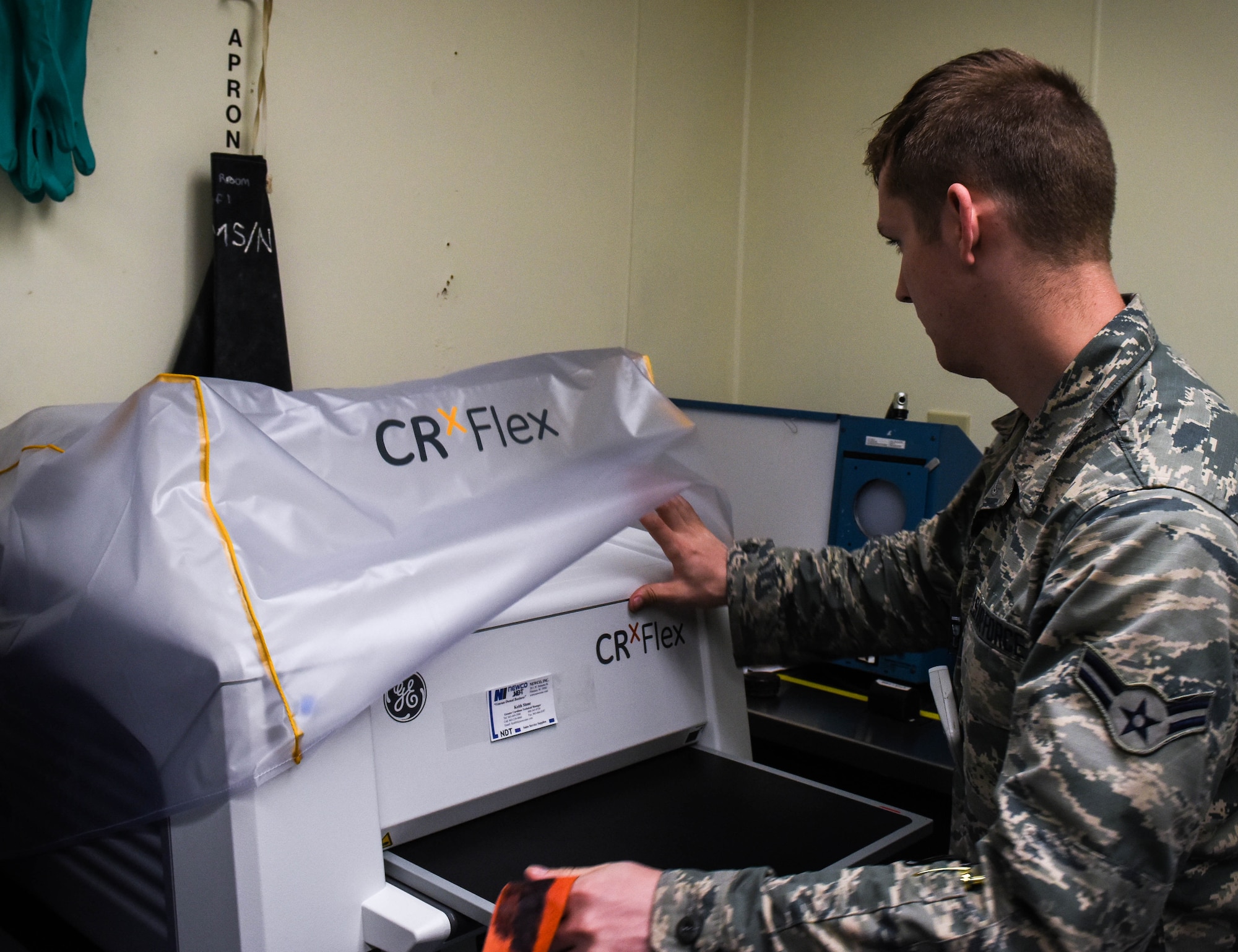 U.S. Air Force Airman 1st Class Tyler Chance, 20th Equipment Maintenance Squadron nondestructive inspection journeyman, uses a Computed Radiography (CR) Flex 2 machine at Shaw Air Force Base, S.C., April 25, 2018.