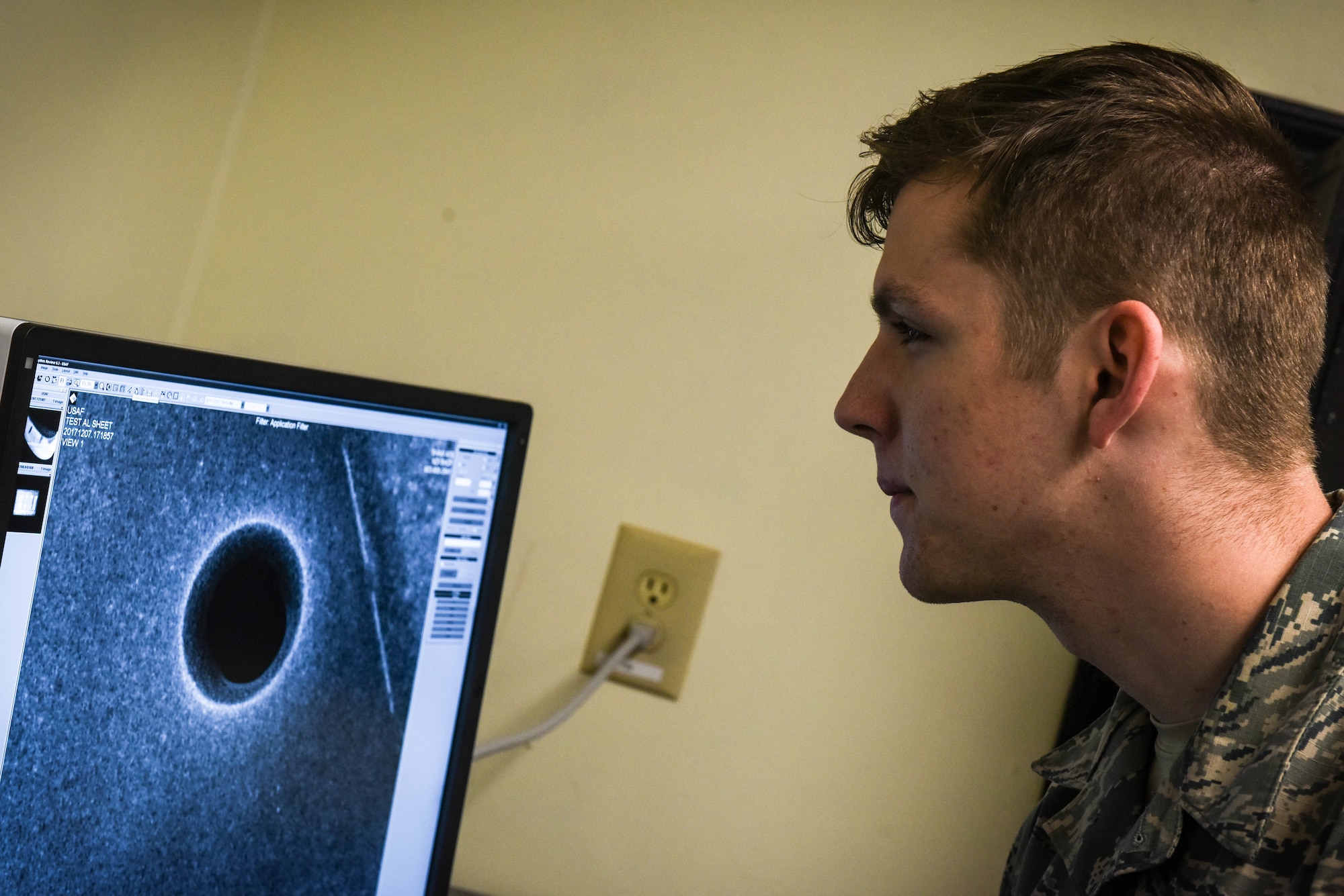 U.S. Air Force Airman 1st Class Tyler Chance, 20th Equipment Maintenance Squadron nondestructive inspection (NDI) journeyman, reviews an X-ray image on a Computed Radiography Flex 2 system at Shaw Air Force Base, S.C., April 25, 2018.