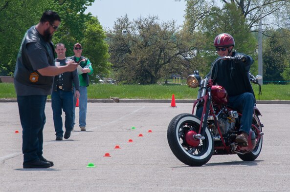 A rider competes in a slow ride contest as part of Wright-Patterson's Motorcycle Safety Day 2018.