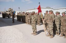 Airmen with the 332nd Air Expeditionary Wing and Soldiers with the 3-2 Air Defense Artillery Unit gather for a retreat ceremony honoring fallen defenders and office of special investigations agents during May 11, 2018, at an undisclosed location in Southwest Asia.
