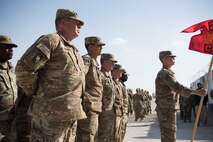 Airmen with the 332nd Air Expeditionary Wing and Soldiers with the 3-2 Air Defense Artillery Unit gather for a retreat ceremony honoring fallen defenders and office of special investigations agents during May 11, 2018, at an undisclosed location in Southwest Asia.