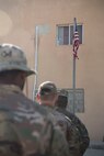Airmen with the 332nd Air Expeditionary Wing and Soldiers with the 3-2 Air Defense Artillery Unit gather for a retreat ceremony honoring fallen defenders and office of special investigations agents during May 11, 2018, at an undisclosed location in Southwest Asia.
