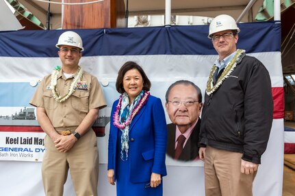 Capt. Casey Moton, DDG-51 program manager, Irene Hirano Inouye (center), future USS Daniel Inouye (DDG 118) sponsor and wife of the late Sen. Daniel Inouye, and Ed Kenyon, Bath Iron Works DDG-51 program director reflect on the ship’s keel authentication ceremony in Bath, Maine, May 14.