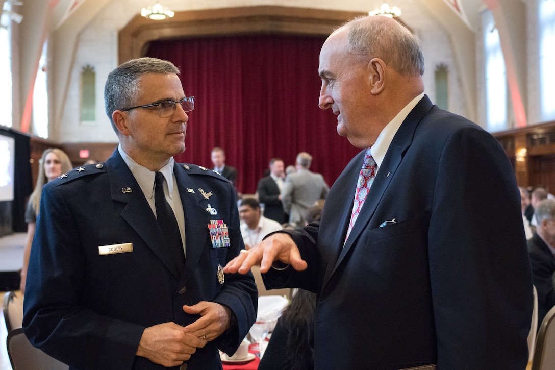 Maj. Gen. William Cooley, commander of the Air Force Research Laboratory, and Dr. Michael McRobbie, president, Indiana University, discuss partnership opportunities between higher education and the Air Force at the Air Force Science and Technology 2030 Forum held May 10 at Indiana University. (Indiana University photo/Chris Meyer)
