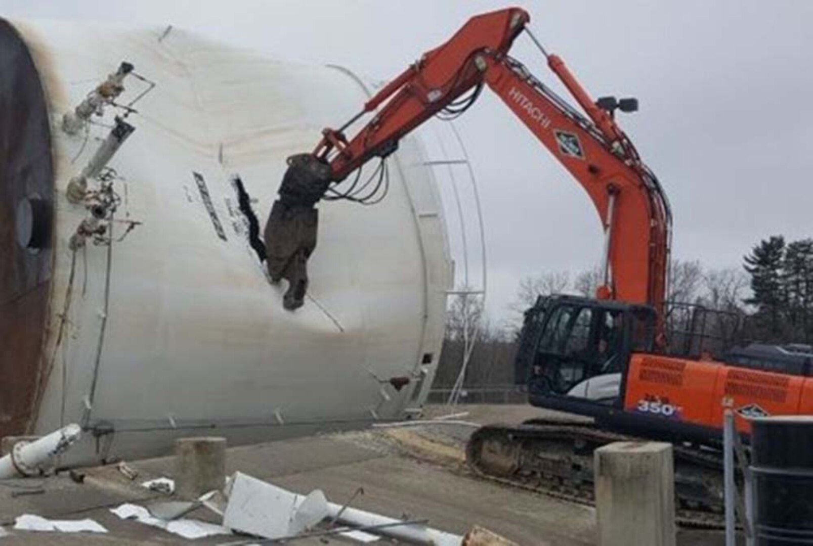 Construction equipment tears through the steel of a fuel tank.