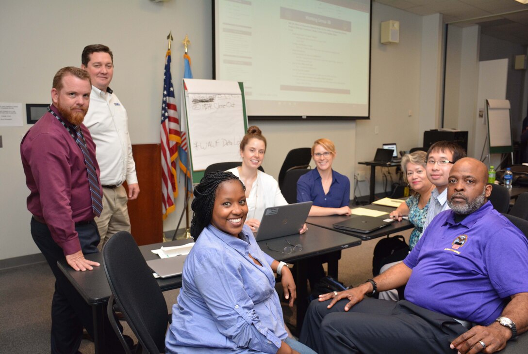 A group of people pose for a photo after a meeting.