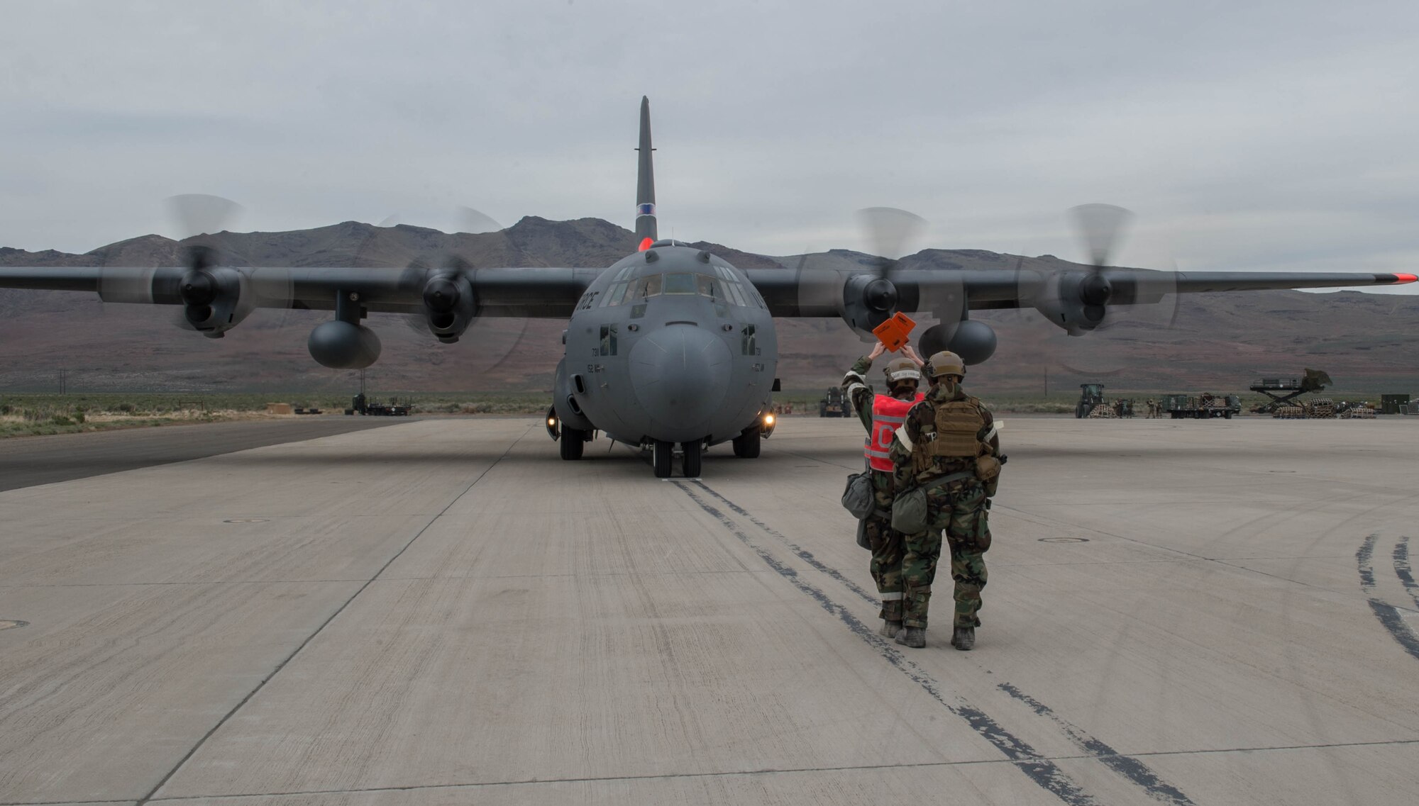 Staff Sgt. Jessica Kindinger, 921st Contingency Response Squadron commander executive, marshalls an aircraft during exercise Cerberus Strike May 5, 2018, at Amedee Army Airfield, Calif.  The contingency response element exercised their ability to execute and sustain rapid global mobility throughout California. (U.S. Air Force photo by Staff Sgt. Robert Hicks)