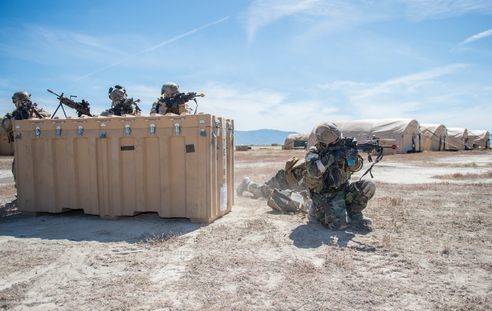 Airmen assigned to the 821st Contingency Response Group provide cover while others use the bounding technique to engage the enemy during a simulated attack during exercise Cerberus Strike May 6, 2018, at Amedee Army Airfield, Calif. Cerberus Strike is a contingency response-centric mobility exercise that gives contingency response forces the opportunity to rehearse potential real-world situations. (U.S. Air Force photo by Staff Sgt. Robert Hicks)