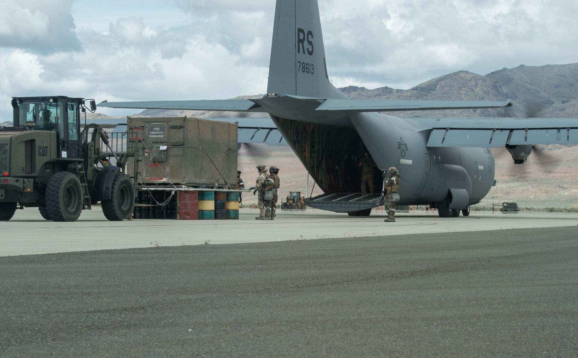 Airmen assigned to the 821st Contingency Response Group performs an engine running offload during exercise Cerberus Strike April 30, 2018, at Amedee Army Airfield, Calif. Cerberus Strike is a contingency response-centric mobility exercise that gives contingency response forces the opportunity to rehearse potential real-world situations. (U.S. Air Force photo by Staff Sgt. Robert Hicks)