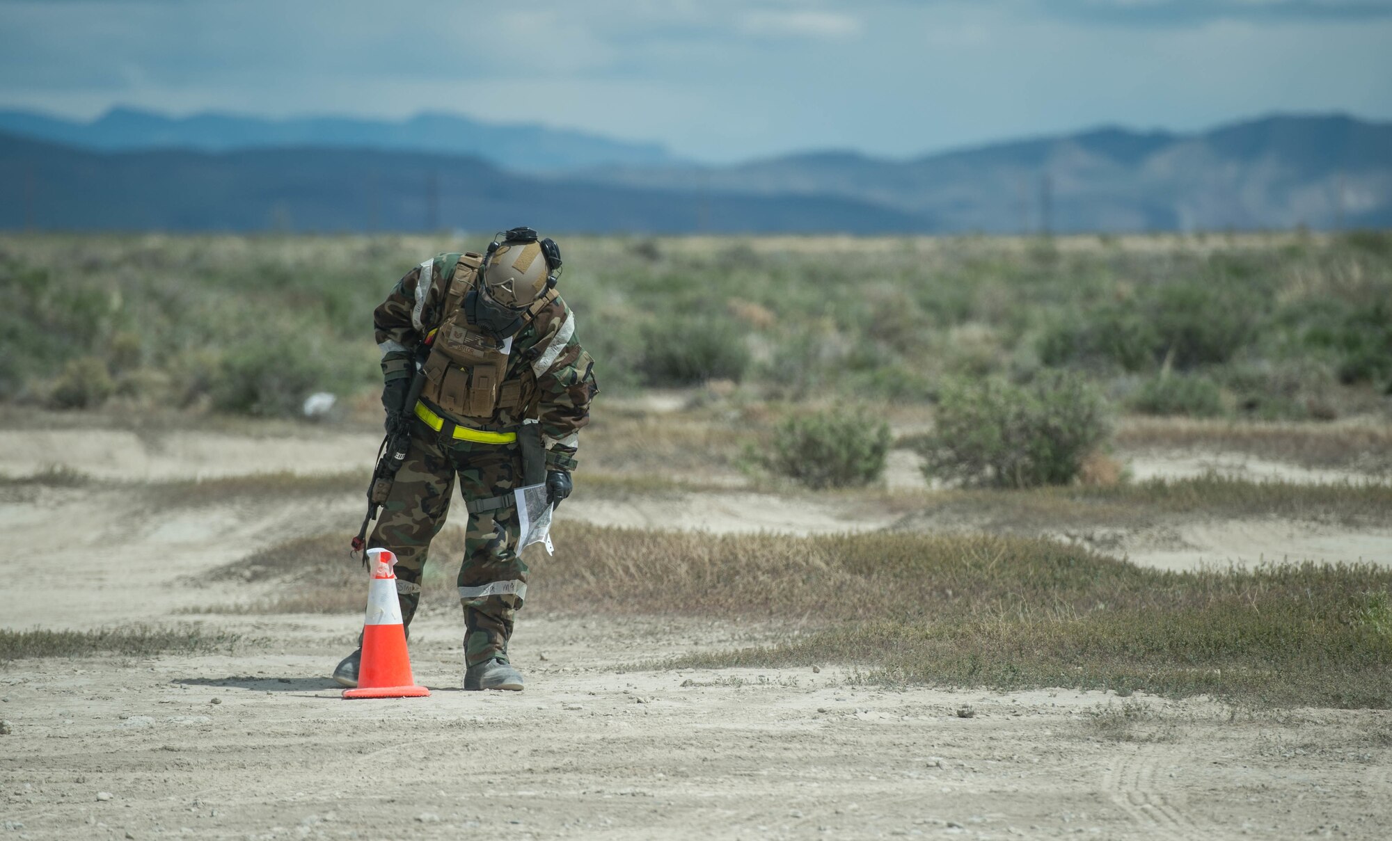 An Airman assigned to the 821st Contingency Response Group observes M8 tape during exercise Cerberus Strike April 30, 2018, at Amedee Army Airfield, Calif. Cerberus Strike is a contingency response-centric mobility exercise that gives contingency response forces the opportunity to rehearse potential real-world situations. (U.S. Air Force photo by Staff Sgt. Robert Hicks)