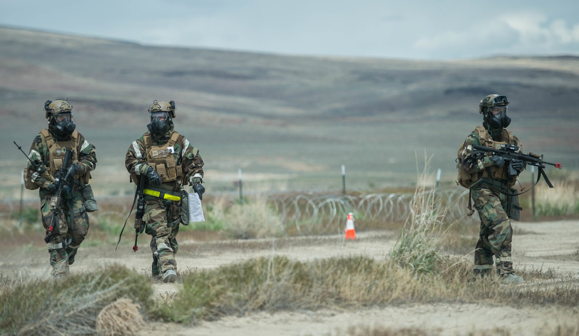 Airmen assigned to the 821st Contingency Response Group perform a post attack reconnaissance sweep during exercise Cerberus Strike April 30, 2018, at Amedee Army Airfield, Calif. Cerberus Strike is a contingency response-centric mobility exercise that gives contingency response forces the opportunity to rehearse potential real-world situations. (U.S. Air Force photo by Staff Sgt. Robert Hicks)