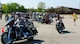 Staff Sgt. Zach Herick, Wright-Patterson Air Force Base Motorcycle Safety Day 2018 lead (right), directs more than 120 motorcycle riders as they depart on an optional 38-mile group ride as part of the event May 11.