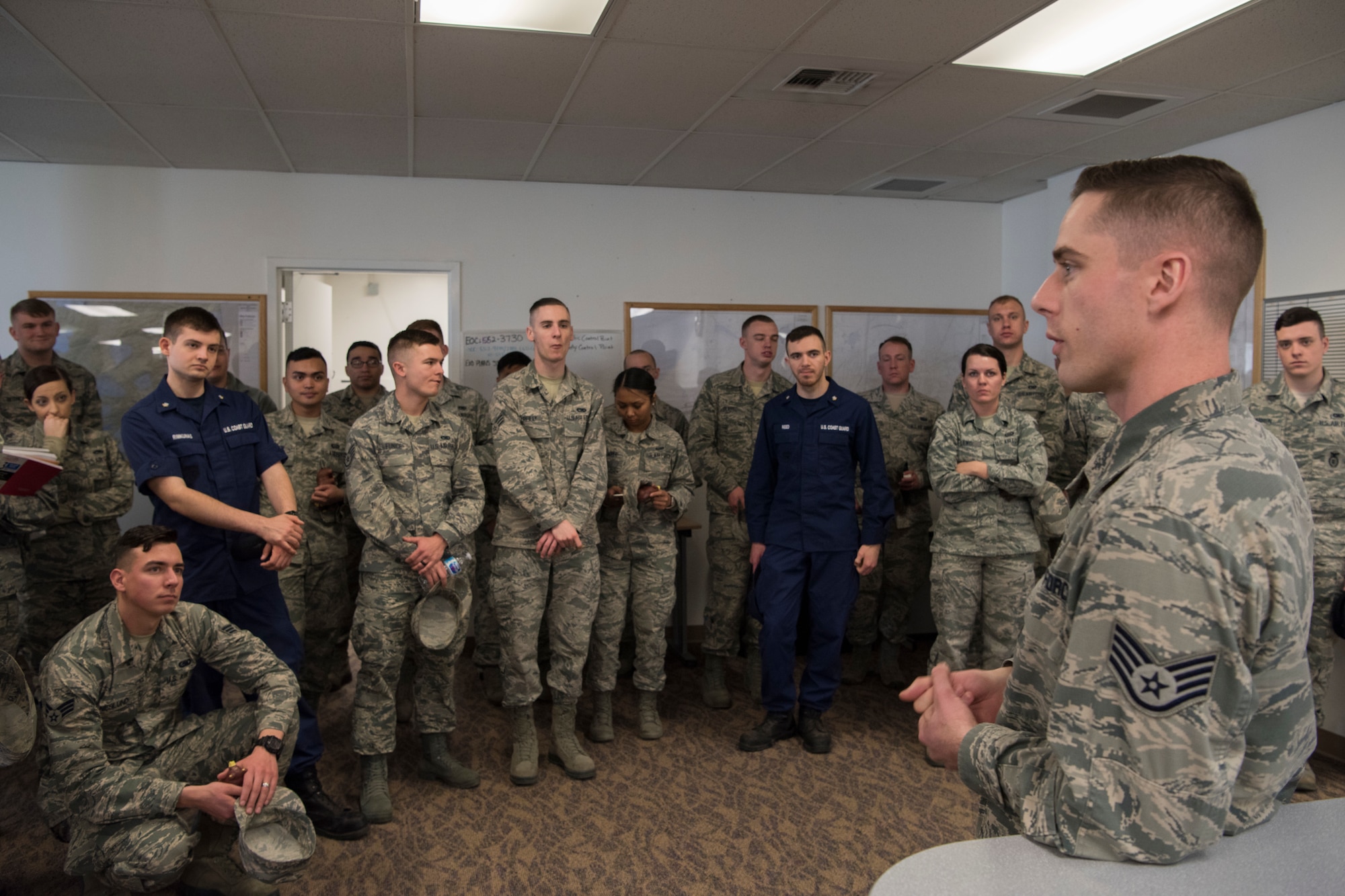 Air Force Staff Sgt. Westin Warburton, 673d Air Base Wing Public Affairs noncommissioned officer in charge of Community Engagement, speaks to Airman Leadership School graduates at Joint Base Elmendorf-Richardson, Alaska, May 10, 2018. The graduates took part in a new Pacific Air Forces-wide initiative for all ALS graduates to reinforce information obtained in Initial Supervisor Resiliency Training. At the forefront of this initiative is a bus tour the day after graduation, which offers an opportunity to see and interact with the programs and resources discussed during the course.