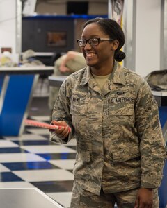 Senior Airman Jakela Neal, 381st Intellegince Squadron cryptologic linguist, plays ping pong at the Warrior Zone as part of an Initial Supervisor Resiliency Training bus tour at Joint Base Elmendorf-Richardson, Alaska, May 10, 2018. The tour is a new Pacific Air Forces-wide initiative for all ALS graduates, which offers an opportunity to see and interact with the programs and resources discussed during the course.