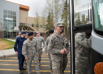Recent Airman Leadership School graduates walk out of the Mental Health clinic as part of an Initial Supervisor Resiliency Training bus tour at Joint Base Elmendorf-Richardson, Alaska, May 10, 2018. The tour is a new Pacific Air Forces-wide initiative for all ALS graduates, which offers an opportunity to see and interact with the programs and resources discussed during the course.