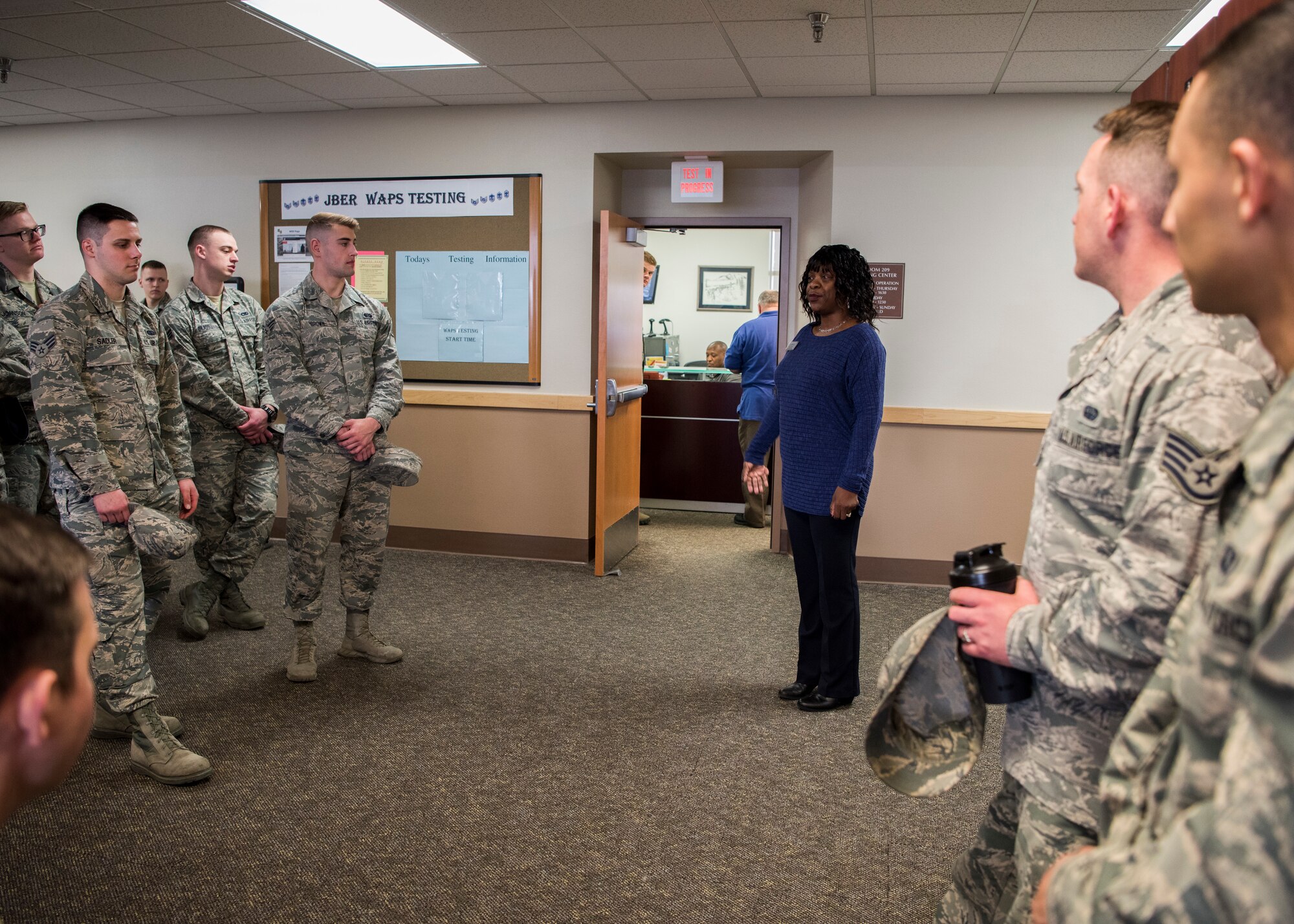 Desiree Thomas Education Center academic counselor, speaks to Airman Leadership School graduates at Joint Base Elmendorf-Richardson, Alaska, May 10, 2018. The graduates took part in a new Pacific Air Forces-wide initiative for all ALS graduates to reinforce information obtained in Initial Supervisor Resiliency Training. At the forefront of this initiative is a bus tour the day after graduation, which offers an opportunity to see and interact with the programs and resources discussed during the course.