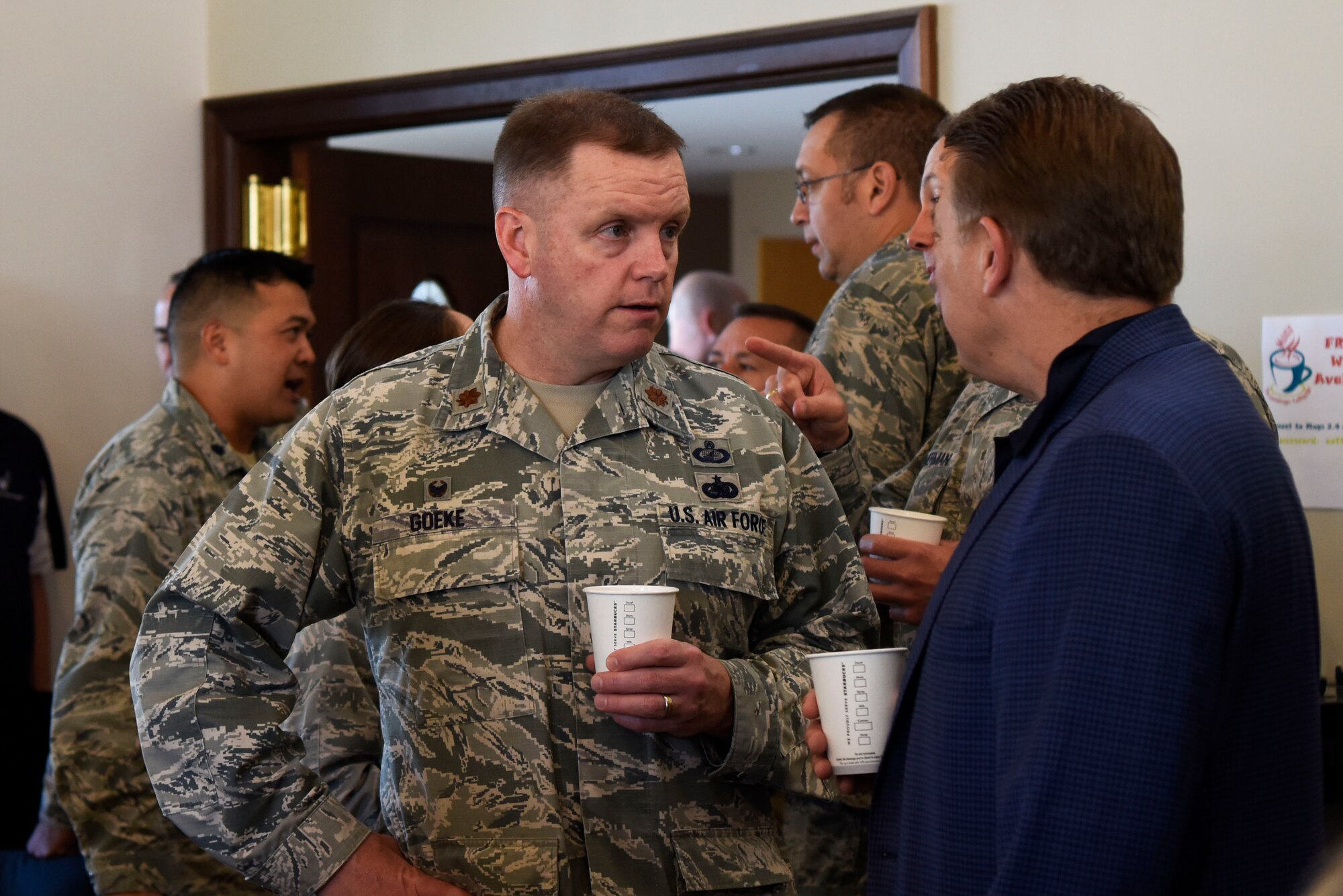 Maj. Robert Goeke, 436th Contracting Squadron commander, and Scott Connell, investment planner at Merrill Lynch, talk an honorary commanders’ meet-and-greet May 9, 2018, at Dover Air Force Base, Del. Each honorary commander is paired with a squadron commander in order to learn more about what the Airmen at Dover AFB do. (U.S. Air Force photo by Airman 1st Class Zoe Wockenfuss)