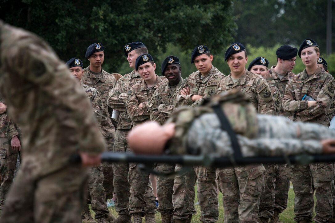 Airmen from the 820th Base Defense Group watch as teams compete in relay-style games during Moody’s celebration of Police Week, May 14, 2018, at Moody Air Force Base, Ga. Police Week is celebrated in May of each year and is a national effort to recognize and honor law enforcement members who have lost their lives in the line of duty. Moody’s 2018 celebration includes a security forces muster, a 5k run, a vehicle showcase with vehicles from the Valdosta Police Department and the Georgia State Patrol as well as memorial ceremonies. (U.S. Air Force photo by Staff Sgt. Ryan Callaghan)