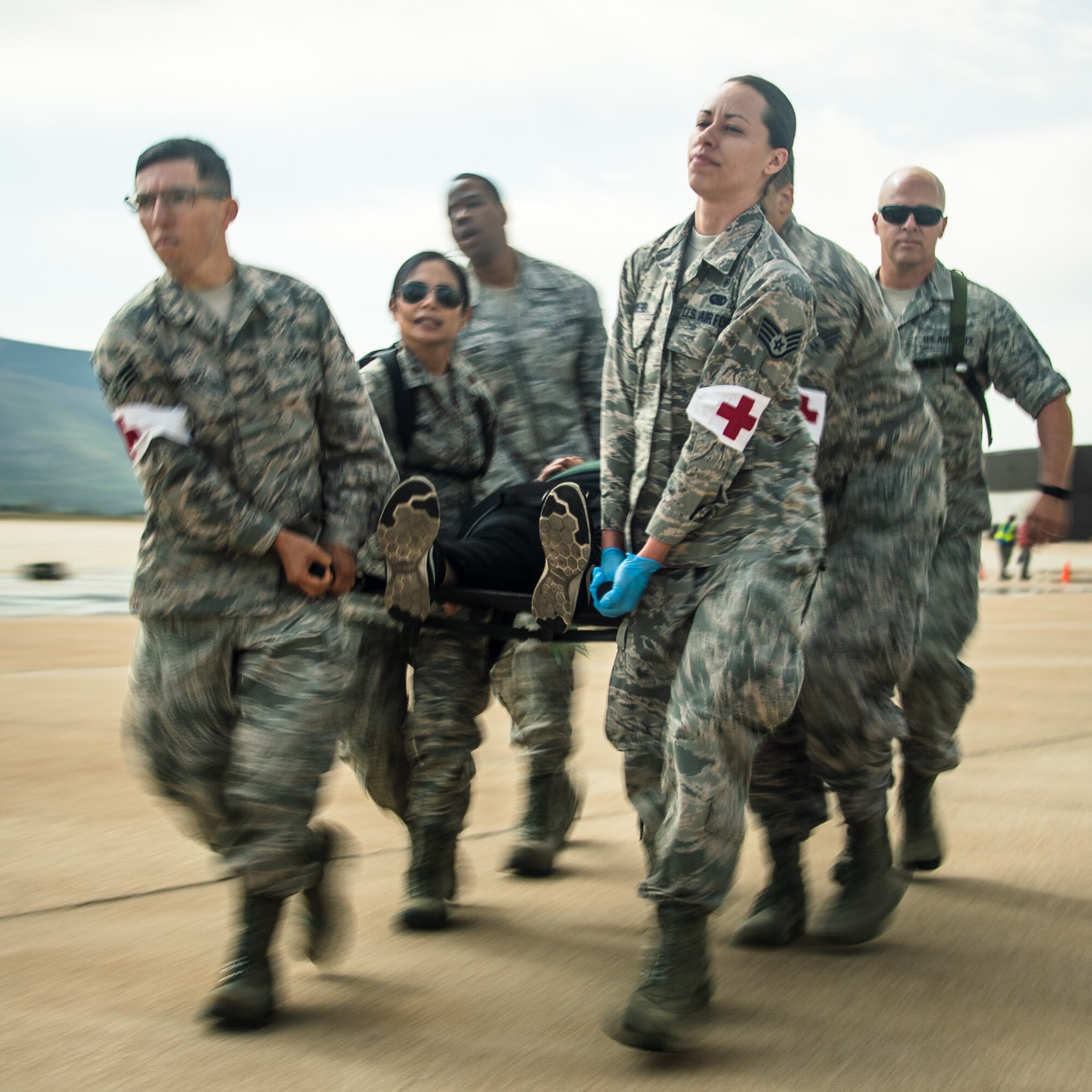 Airmen carry a simulated casualty during an major accident response exercise May 9, 2018, at Hill Air Force Base, Utah. Emergency response personnel from the base and surrounding communities participated in the exercise along with Airmen in prepartion for the Warriors Over the Wasatch Air and Space Show June 23-24. (U.S. Air Force photo by R. Nial Bradshaw)
