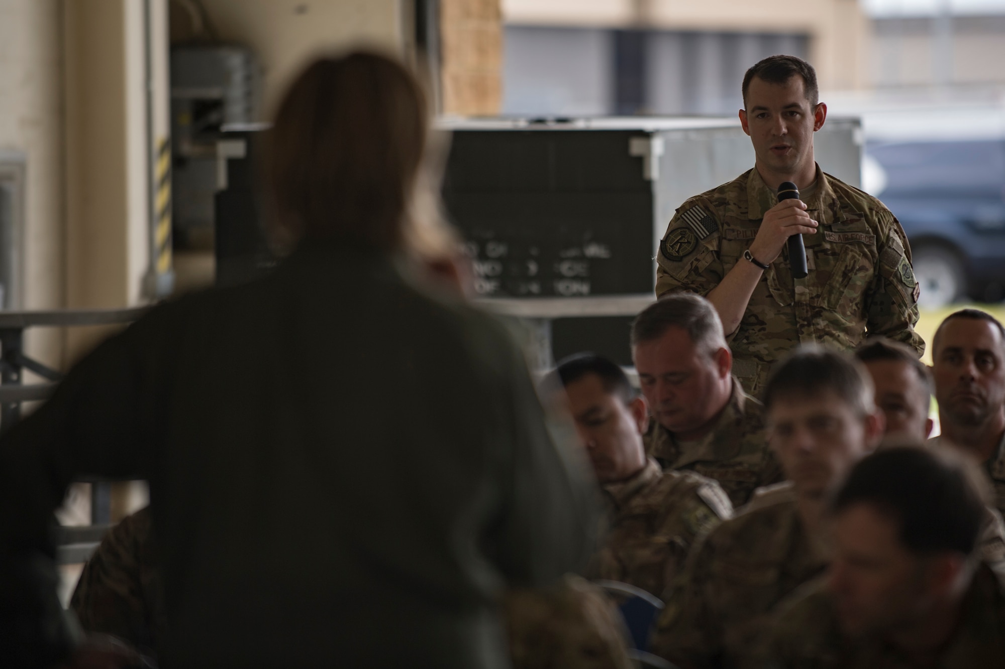 Maj. Cory Pilinko, 71st Rescue Squadron HC-130J Combat King II weapons officer, , participates in an open forum with Col. Jennifer Short, 23d Wing commander, during a one-day operational safety review, May 14, 2018, at Moody Air Force Base, Ga. During the safety review, the commander-led forum gathered feedback from Airmen who execute the Air Force's flying and maintenance operations and challenged them to identify issues that may cause a future mishap. (U.S. Air Force photo by Senior Airman Daniel Snider)