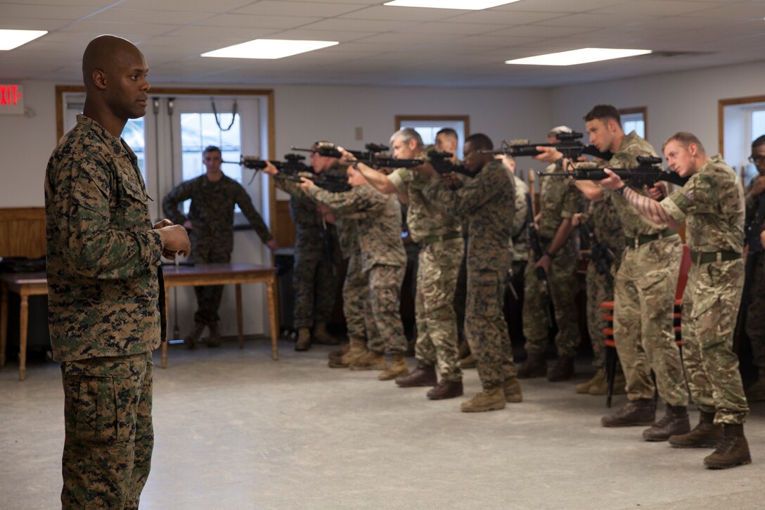 U.S. Marine Staff Sgt. Leon D. Austin, utilities chief with Inspector Instructor Staff, Engineer Support Company, 6th Engineer Support Battalion, 4th Marine Logistics Group, Marine Forces Reserve, instructs a combat marksmanship class with an integrated platoon of Marines with 6th Engineer Support Battalion, 4th Marine Logistics Group, Marine Forces Reserve, and commandos with 131 Commando Squadron Royal Engineers, British army, during exercise Red Dagger at Fort Indiantown Gap, Pa., May 13, 2018.