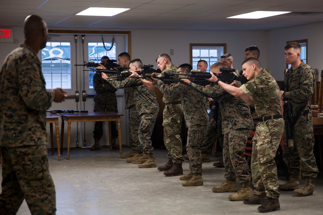U.S. Marine Staff Sgt. Leon D. Austin, utilities chief with Inspector Instructor Staff, Engineer Support Company, 6th Engineer Support Battalion, 4th Marine Logistics Group, Marine Forces Reserve, instructs a combat marksmanship class with an integrated platoon of Marines with 6th Engineer Support Battalion, 4th Marine Logistics Group, Marine Forces Reserve, and commandos with 131 Commando Squadron Royal Engineers, British army, during exercise Red Dagger at Fort Indiantown Gap, Pa., May 13, 2018.