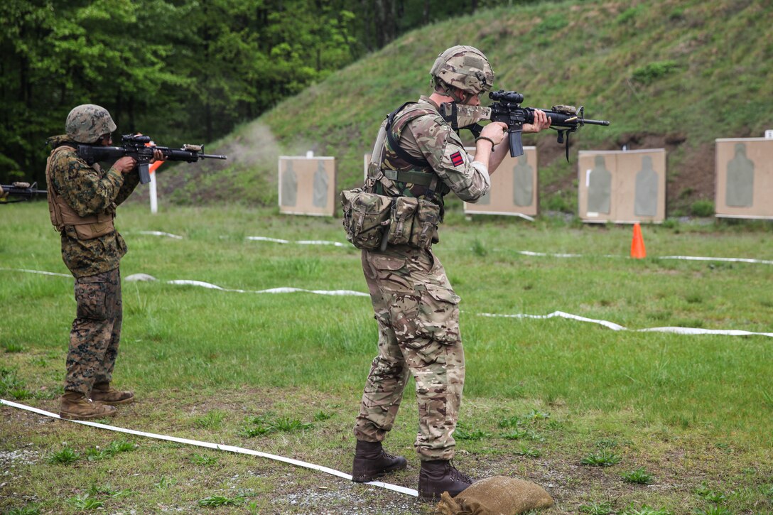U.S. Marine Lance Cpl. Michael D. Foy (left), motor vehicle operator with Bridge Company Bravo, 6th Engineer Support Battalion, 4th Marine Logistics Group, Marine Forces Reserve, and British army Spr. Mark R. Maton (right), British commando with 131 Commando Squadron Royal Engineers, British army, fire at their targets during a live fire range of tables five and six during exercise Red Dagger at Fort Indiantown Gap, Pa., May 14, 2018.