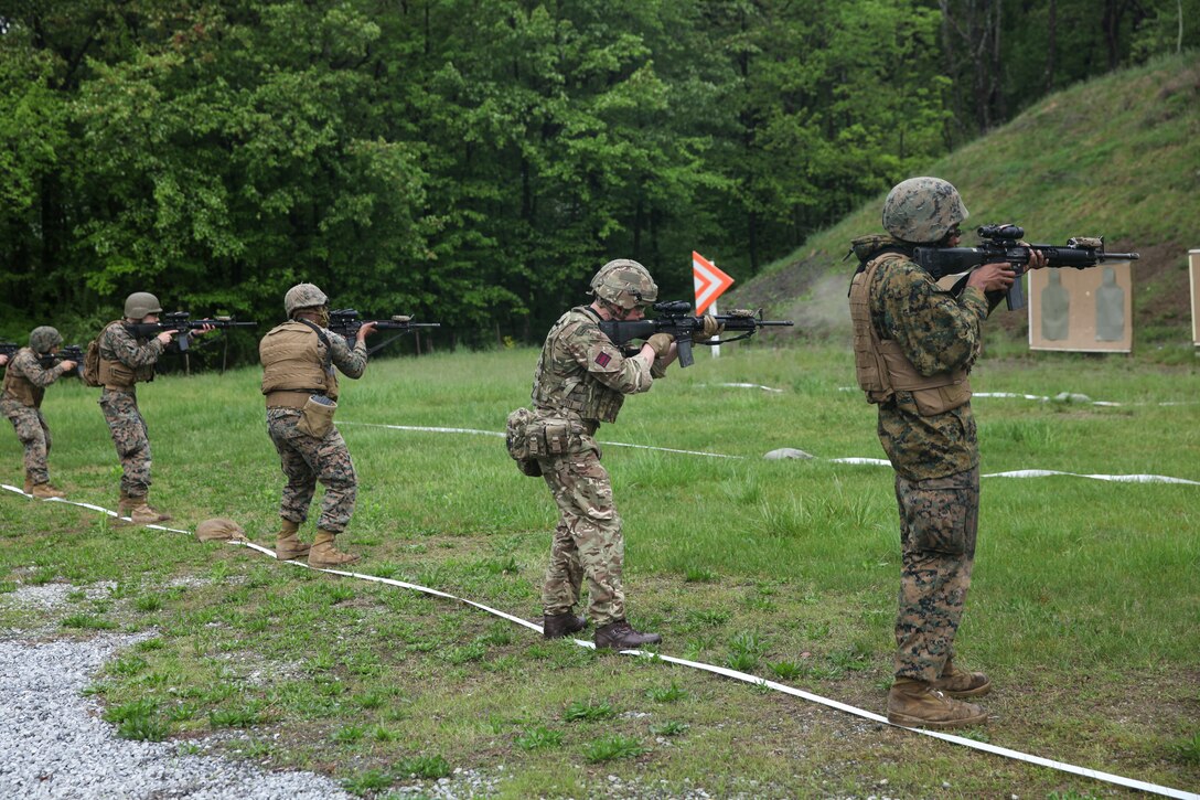 U.S. Marines with 6th Engineer Support Battalion, 4th Marine Logistics Group, Marine Forces Reserve, and British commandos with 131 Commando Squadron Royal Engineers, British army, shoot tables five and six at the rifle range during exercise Red Dagger at Fort Indiantown Gap, Pa., May 14, 2018.