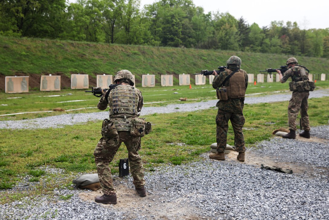 British army Spr. Jonathan Wallace (left), and Spr. Mark R. Maton (right), British commando’s with 131 Commando Squadron Royal Engineers, British army, and U.S. Marine Lance Cpl. Michael D. Foy (center), motor vehicle operator with Bridge Company Bravo, 6th Engineer Support Battalion, 4th Marine Logistics Group, Marine Forces Reserve, fire at their targets during a live fire range of tables five and six during exercise Red Dagger at Fort Indiantown Gap, Pa., May 14, 2018.